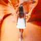 Young girl exploring Antilope Canyon in Arizona. Antilope canyon the most beautiful canyon in USA - PhotoDune Item for Sale