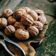 Walnuts on rustic wooden table - PhotoDune Item for Sale