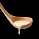 condensed milk in wooden ladle - PhotoDune Item for Sale
