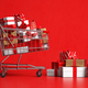 Shopping cart with gift box on red background. - PhotoDune Item for Sale