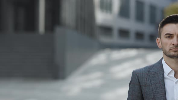Close-up Half Face Portrait of Caucasian Handsome Professional Young Businessman Looking at Camera alt