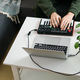 Man recording electronic music track with portable midi keyboard on laptop computer in home studio - PhotoDune Item for Sale