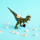 Green dinosaur with fried eggs and coffee cups on blue background. - PhotoDune Item for Sale