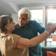 Elderly Couple Dancing Together at Home - PhotoDune Item for Sale
