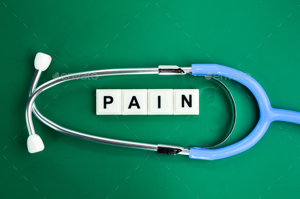 stethoscope and alphabet letters with the word pain. Stock Photo by ...