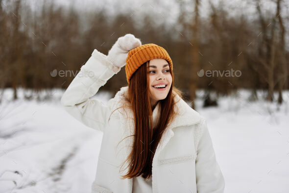 woman in winter clothes in a hat fun winter landscape There is a lot of snow  around Stock Photo by shotprime