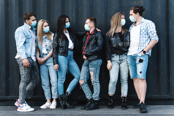 Group of friends wearing prevention masks