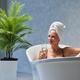 Attractive woman taking bath with glass of champagne in bathroom. - PhotoDune Item for Sale
