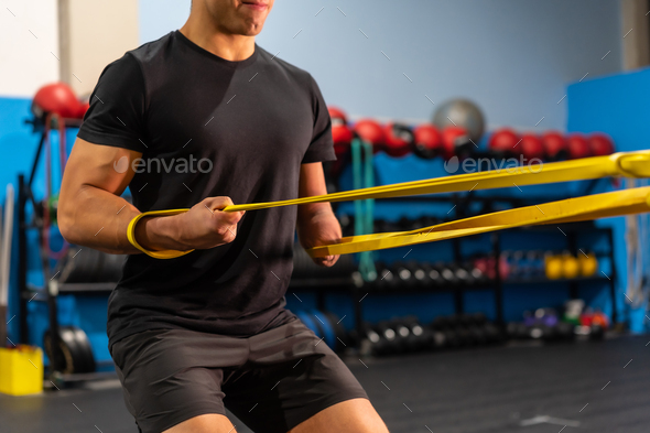 Unrecognizable sportive man with an arm amputated training in a gym Stock  Photo by Unai82