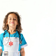 six year old girl standing with brown curly hair smiling dressed as a nurse on white background - PhotoDune Item for Sale