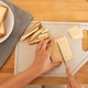 female hands cutting bread for toast - PhotoDune Item for Sale