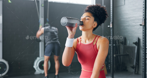 women with bottles of water in gym, Stock image