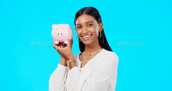 Piggy bank, happy face and Indian woman with a smile from savings, investment and finance. Isolated