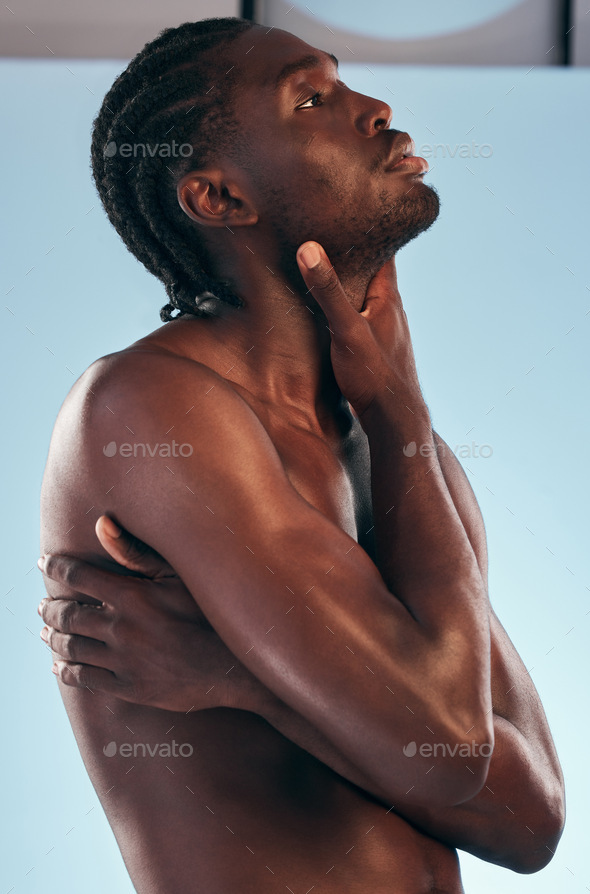 Body, black man and profile in studio with art, skincare and glow from skin wellness and confidence