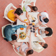 Vertical high angle view of a group of friends having a dinner party celebration at home terrace - PhotoDune Item for Sale