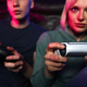 Close up of young caucasian couple playing video game with game pads - PhotoDune Item for Sale