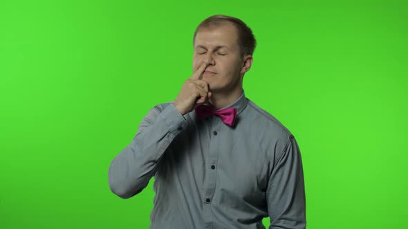 Funny Stupid Man Picking Nose. Silly Brainless Humorous Expression, Removing Boogers, Bad Manners alt