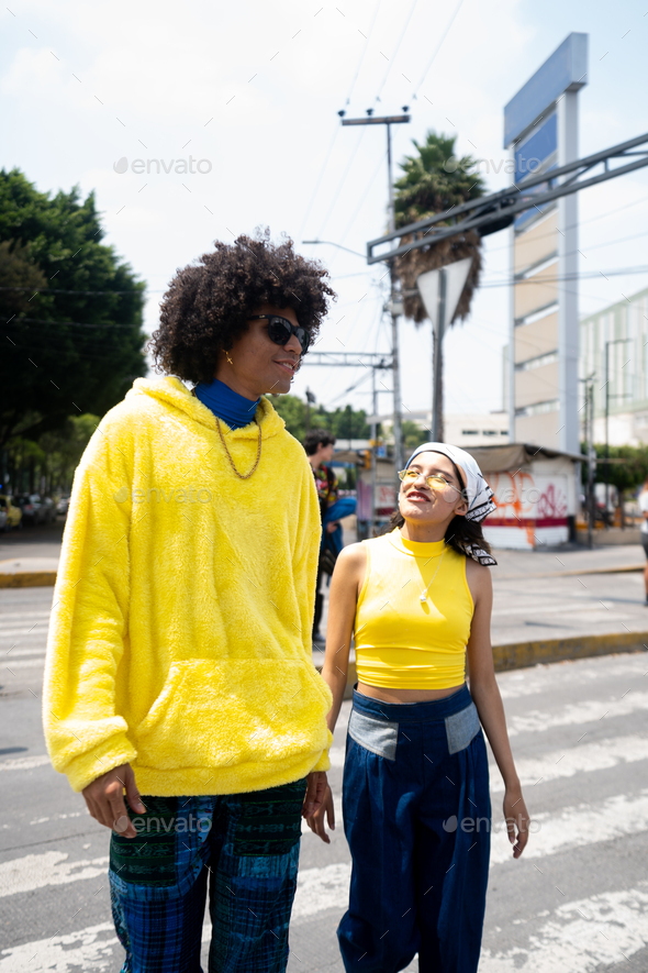 afro mexican man and a young woman going to the bus station at Mexico ...