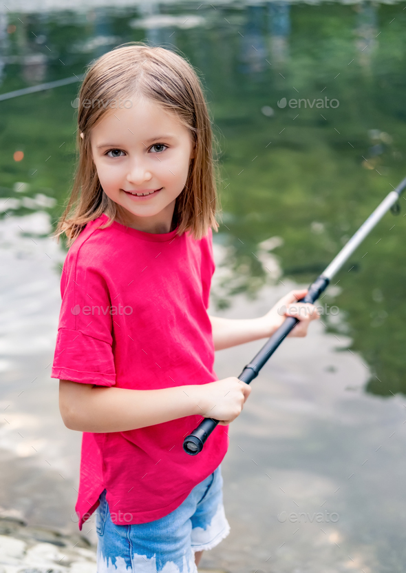 Little girl holding fishing rod Stock Photo by AFGreen