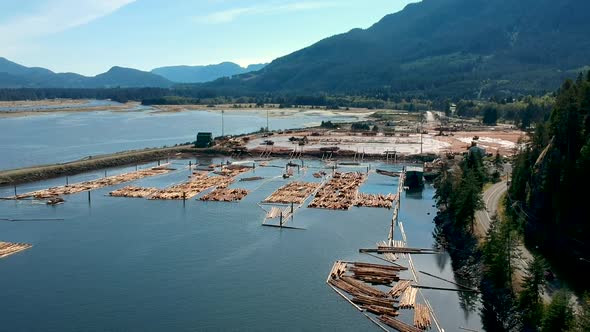 Log booms with mountains in background alt