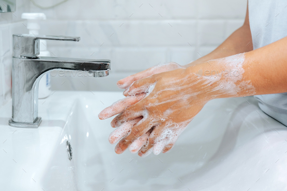 Asian woman washing with Soap hands thoroughly to Corona virus prevention