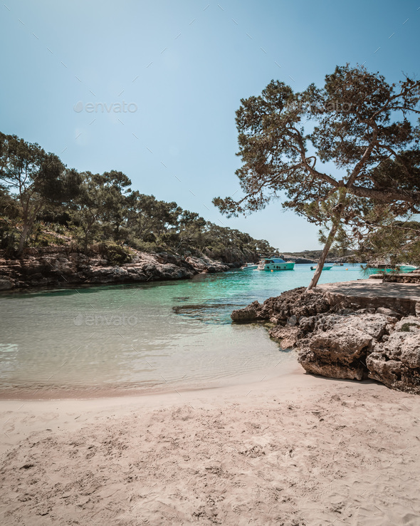 Beautiful view of a beach Cala Mitjana, Mallorca under the clear sky - Stock Photo - Images