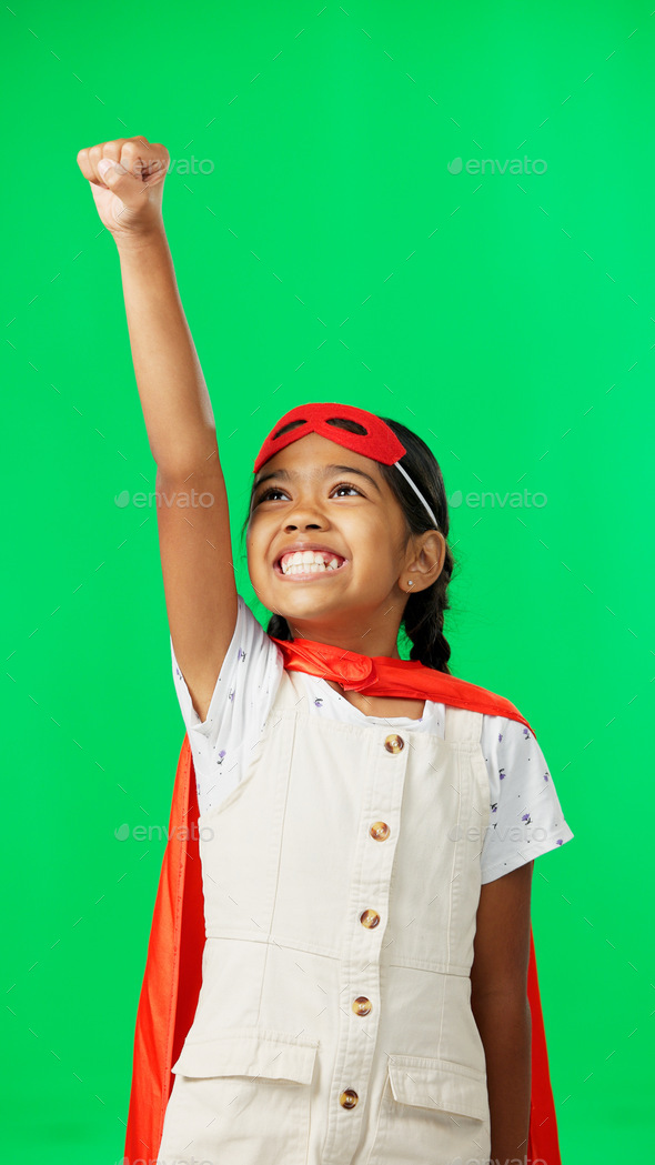 Costume, face and child in a studio with green screen doing a superhero pose and outfit. Happy, smi