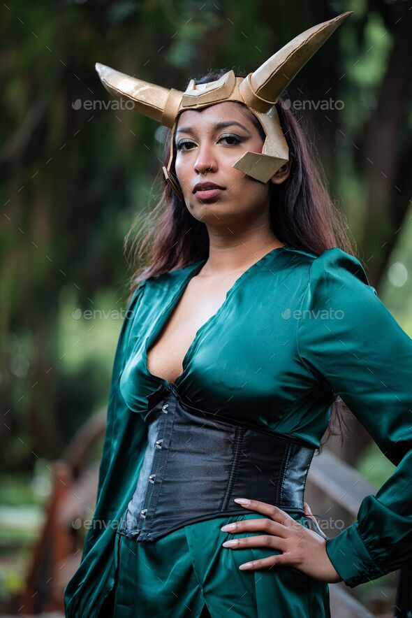 Female cosplayer dressed up as Loki Stock Photo by wirestock | PhotoDune