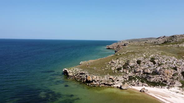 Aerial view of beautiful rocky beaches on Azov seashore in Crimea