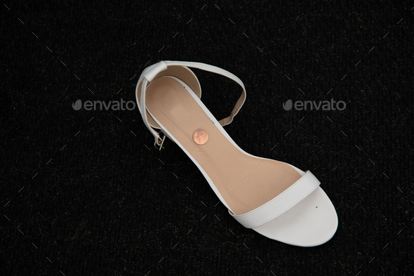 White wedding shoe with penny in it - happy marriage tradition, Good luck charm