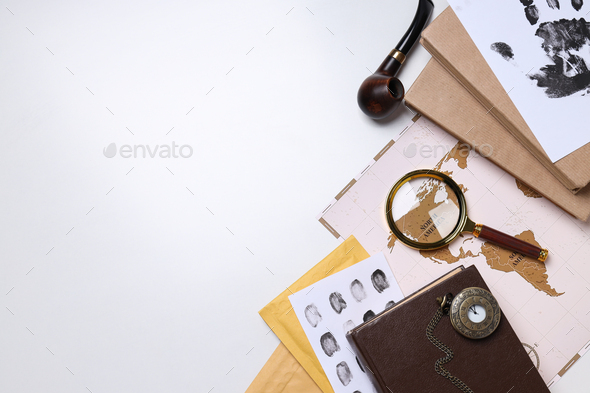 Magnifying glass with fingerprints on a white background Stock Photo by