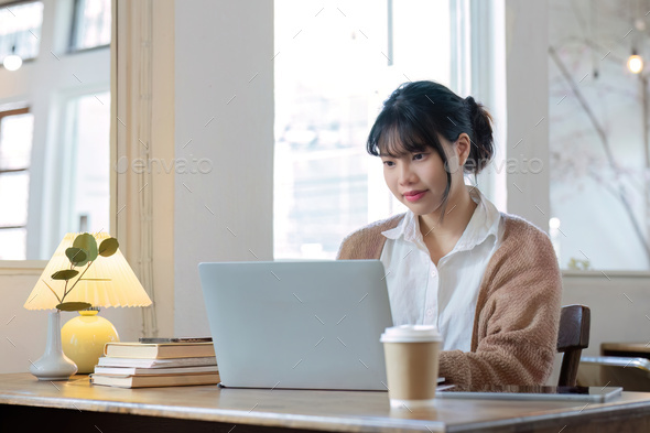 Asian female student studying online, studying on a video call, zoom call, passionate Asian female