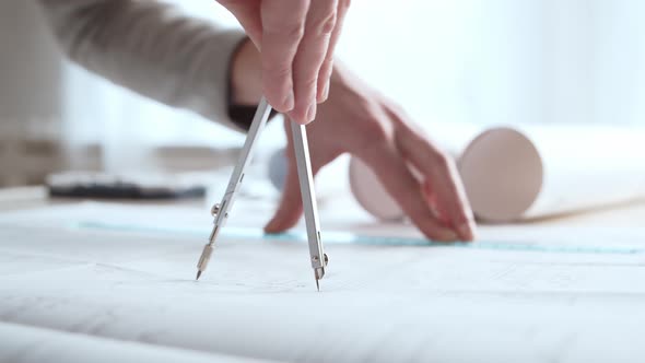 Close-up of an architect's hands. Professional real estate designer alt