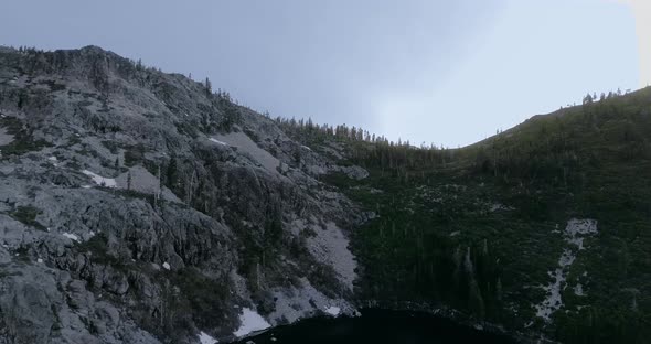 Aerial view on grey rocky shore of Castle Lake, Shasta-Trinity, California, USA alt