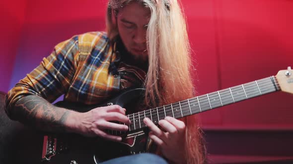 Virtuoso Guitarist Playing an Electric Guitar alt
