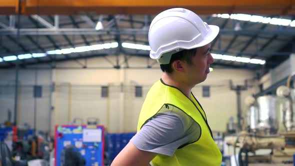 Asian Engineer Stretching Body During Break alt