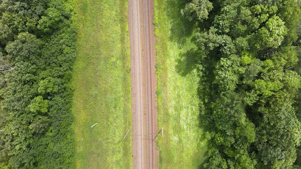Train Way, Railroad tracks Through Green Grassed Countryside, Aerial, Drone View.