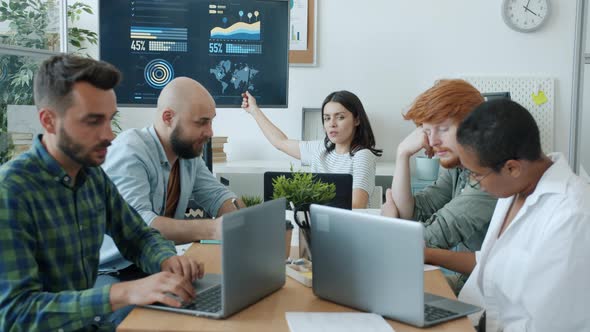 Young Woman Making Presentation Then Throwing Paper Balls at Unattentive Employees in Office alt