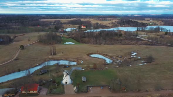 Old Araisi Windmill in Latvia Aerial Shot From Above. Winter Day at Sunrise 4K Video alt