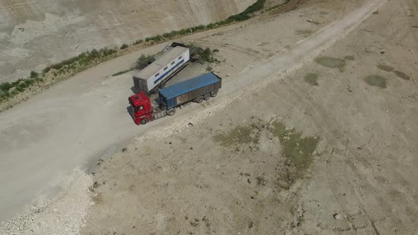 Aerial Shot of Truck with Garbage is Parking on Junkyard for Unloading