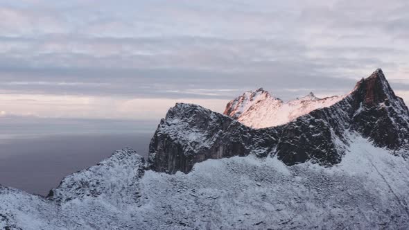 Norwegian Mountain Range Landscape In Snow At Sunrise alt