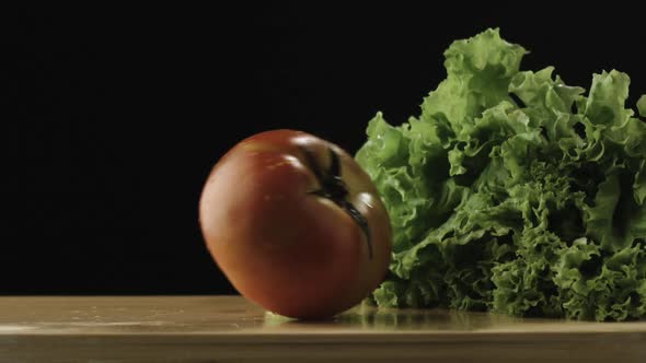 Slow-motion of Tomato Hitting Lettuce alt