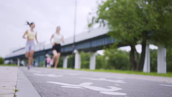 Sportswoman Runs From Crunch Start Position Near Friend