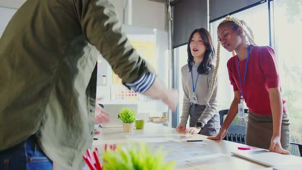 Meeting of UX developer and UI designer brainstorming about mobile app interface alt