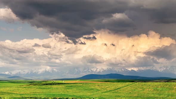 The Movement of Volumetric Clouds over the Hills In Spring in Sunny Weather