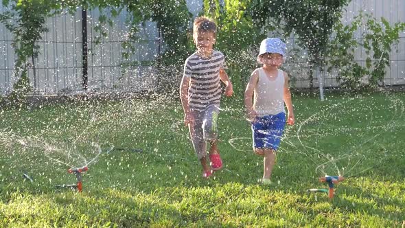 Automatic watering systems. Exciting games outdoor. Happy childhood concept. Alternative studying.