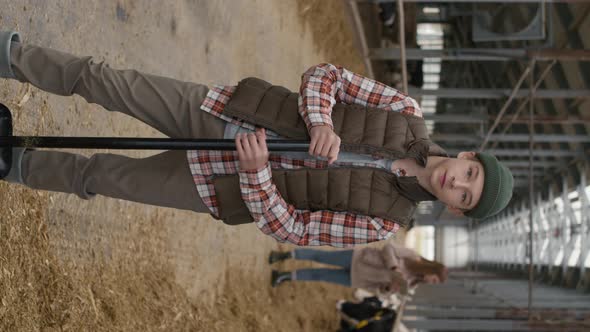 Vertical Portrait of Teenage Boy at Cattle Farm alt