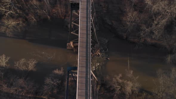 Flying directly over High Bridge Trail, a reconstructed Civil War railroad bridge in Virginia, looki alt