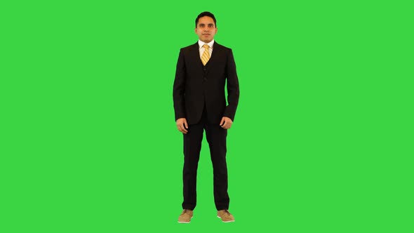 Happy Successful Businessman Showing Thumbs Up and Pointing at you Ethnic Business Man Approval on a