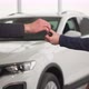 Vehicle Purchase Happy Male Buyer Takes Keys to a New Car and Shakes Hands with Auto Dealership - VideoHive Item for Sale